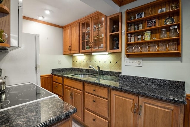 8 Franklin St Unit 18, Marblehead, MA 01945 - kitchen with open shelves, a sink, brown cabinetry, crown molding, and freestanding refrigerator