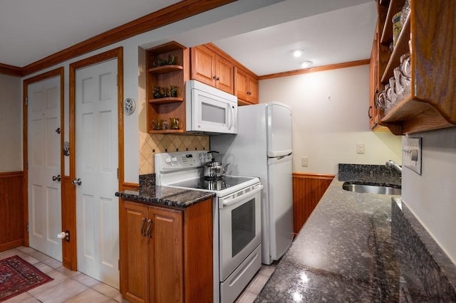 8 Franklin St Unit 18, Marblehead, MA 01945 - kitchen with white appliances, a sink, open shelves, ornamental molding, and a wainscoted wall