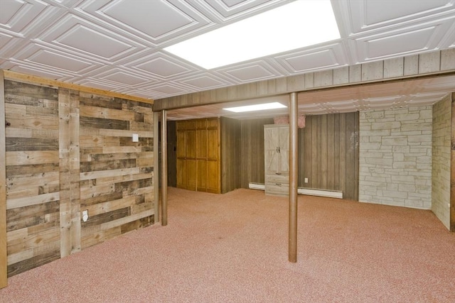 8 Field St, Southwick, MA 01077 - finished below grade area with wooden walls, carpet floors, and a baseboard heating unit