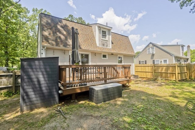 8 Field St, Southwick, MA 01077 - rear view of house featuring a wooden deck, a shingled roof, and central AC unit