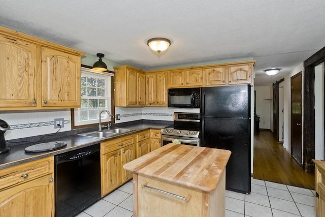 8 Field St, Southwick, MA 01077 - kitchen with black appliances, a sink, light tile patterned flooring, wooden counters, and tasteful backsplash
