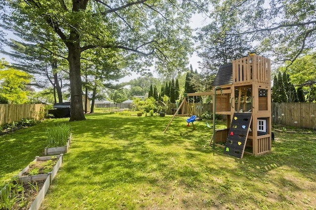 8 Field St, Southwick, MA 01077 - view of yard with a playground and a vegetable garden