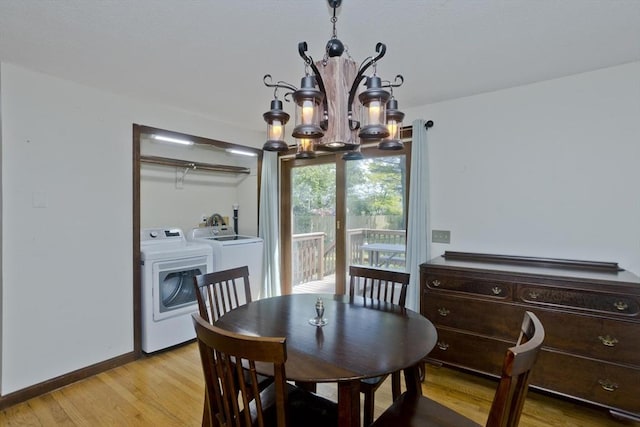 8 Field St, Southwick, MA 01077 - dining area featuring a chandelier, washer and clothes dryer, light wood-type flooring, and baseboards