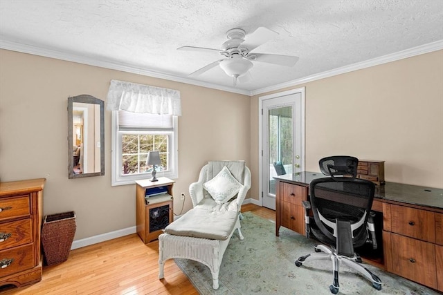 office featuring baseboards, crown molding, a textured ceiling, and light wood finished floors