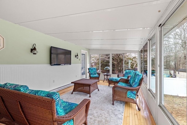 sunroom / solarium featuring a baseboard heating unit