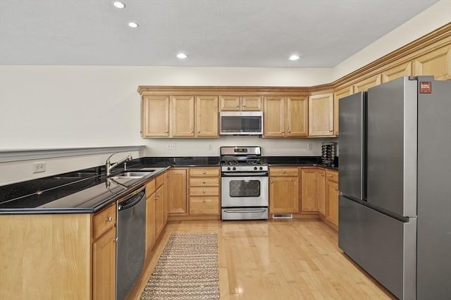 508 Linwood Ct Unit 508, Clinton, MA 01510 - kitchen featuring appliances with stainless steel finishes, light wood-style flooring, dark countertops, and recessed lighting