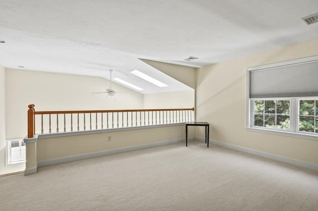 508 Linwood Ct Unit 508, Clinton, MA 01510 - carpeted empty room featuring a ceiling fan, a skylight, and vaulted ceiling