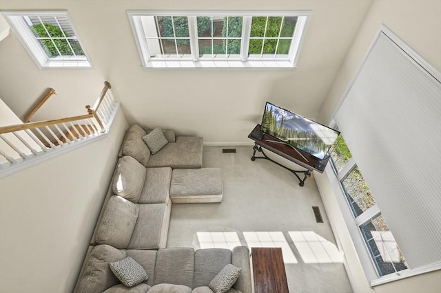 508 Linwood Ct Unit 508, Clinton, MA 01510 - carpeted living area with a high ceiling and baseboards