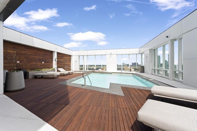 view of pool with a wooden deck