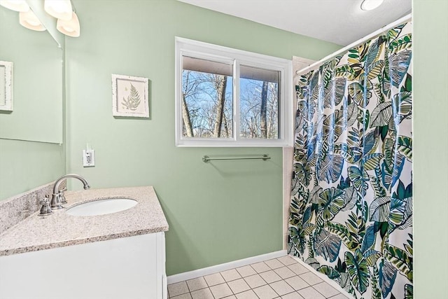 bathroom with tile patterned flooring and vanity