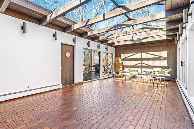 view of patio / terrace with a baseboard heating unit and a pergola