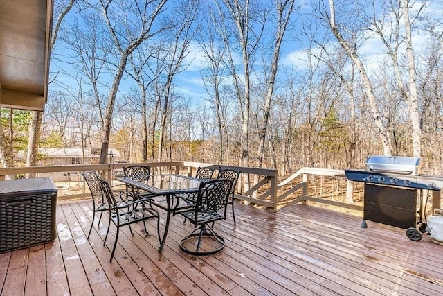 wooden terrace featuring grilling area