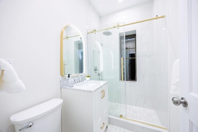 bathroom with a marble finish shower, toilet, and vanity