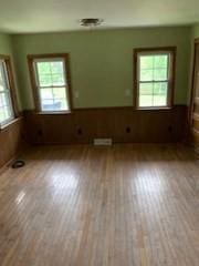 273 Dunhamtown Palmer Rd, Brimfield, MA 01010 - unfurnished room featuring healthy amount of natural light, wainscoting, and wood finished floors