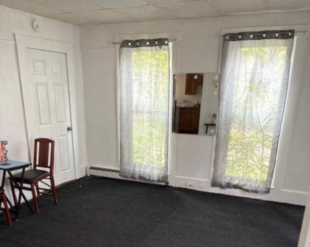 1098 Pleasant St, Palmer, MA 01069 - unfurnished dining area featuring dark carpet, a drop ceiling, and baseboard heating
