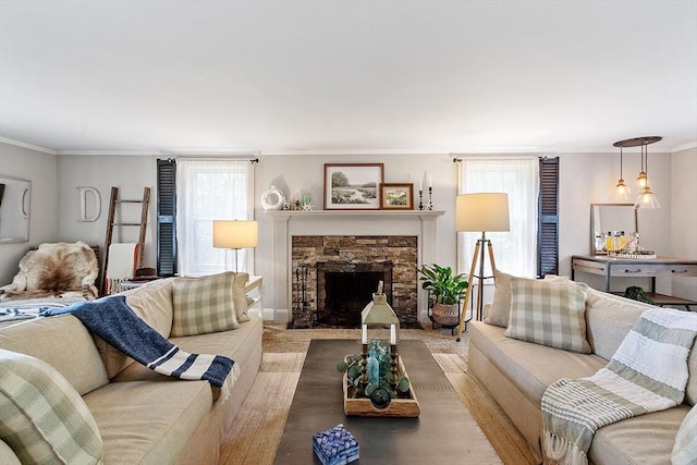 24 Summit Ave, Chelmsford, MA 01824 - living room with healthy amount of natural light, crown molding, a stone fireplace, and wood finished floors