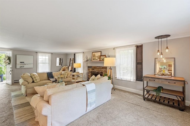24 Summit Ave, Chelmsford, MA 01824 - living area featuring light colored carpet, baseboards, ornamental molding, plenty of natural light, and a stone fireplace