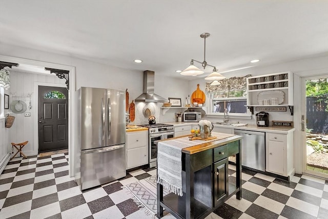 24 Summit Ave, Chelmsford, MA 01824 - kitchen with wall chimney range hood, stainless steel appliances, light flooring, light countertops, and a sink