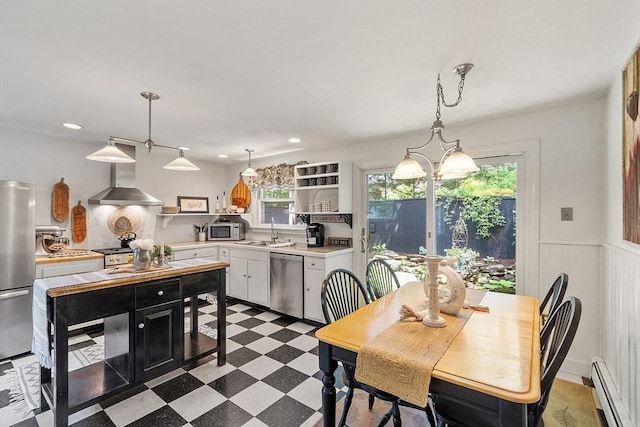 24 Summit Ave, Chelmsford, MA 01824 - kitchen with a baseboard radiator, appliances with stainless steel finishes, wall chimney exhaust hood, tile patterned floors, and light countertops