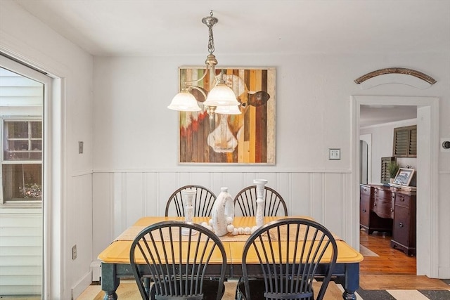 24 Summit Ave, Chelmsford, MA 01824 - dining space with wainscoting, wood finished floors, and a decorative wall