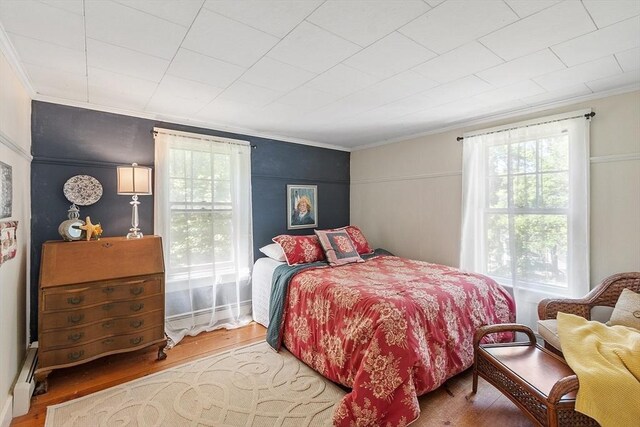 24 Summit Ave, Chelmsford, MA 01824 - bedroom with ornamental molding, multiple windows, and wood finished floors