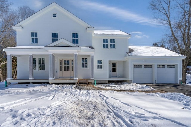 view of front of house with a porch and a garage