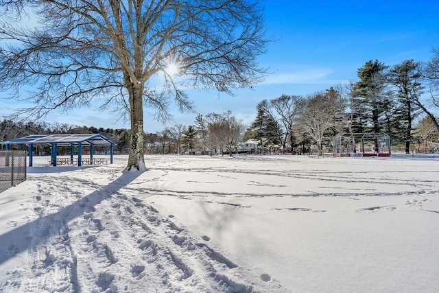 yard covered in snow featuring a gazebo