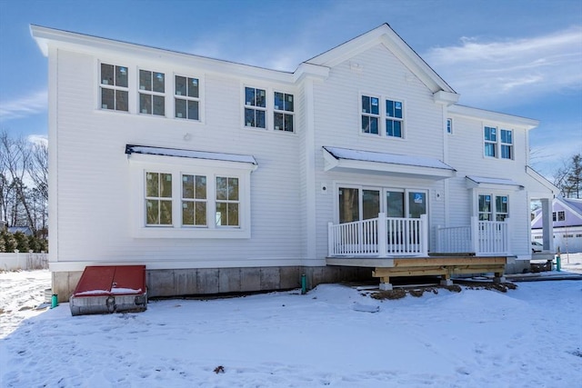 view of snow covered house