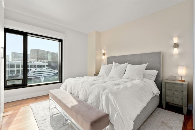 bedroom with light wood-type flooring