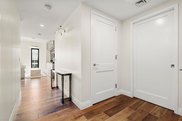 hall featuring hardwood / wood-style flooring