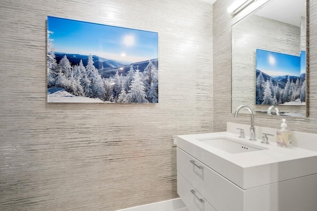 bathroom featuring vanity and tile walls