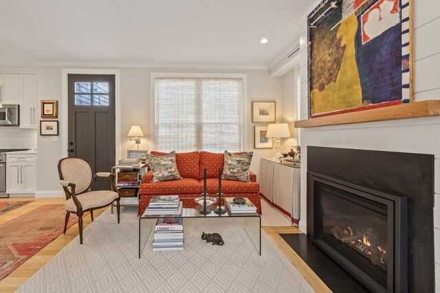 350 Bradford St Unit 7, Provincetown, MA 02657 - living room featuring ornamental molding, a fireplace with flush hearth, and recessed lighting