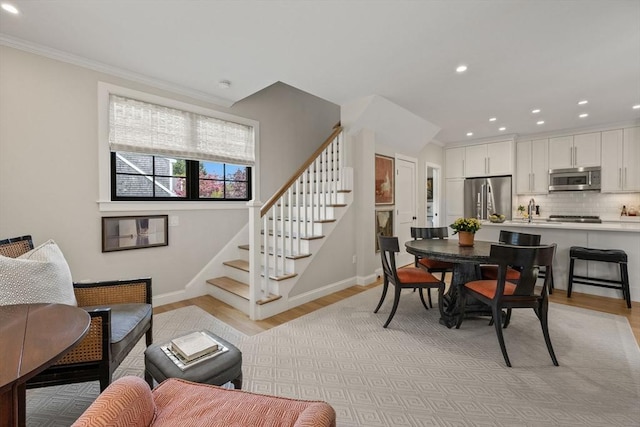 350 Bradford St Unit 7, Provincetown, MA 02657 - dining area featuring stairs, light wood-style flooring, recessed lighting, and ornamental molding