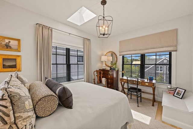 350 Bradford St Unit 7, Provincetown, MA 02657 - bedroom featuring a skylight and a chandelier