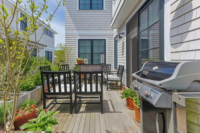 350 Bradford St Unit 7, Provincetown, MA 02657 - wooden terrace featuring outdoor dining space and a grill
