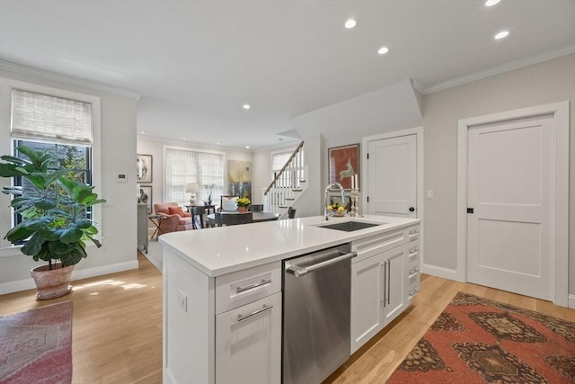 350 Bradford St Unit 7, Provincetown, MA 02657 - kitchen featuring stainless steel dishwasher, recessed lighting, light wood-type flooring, light countertops, and white cabinetry