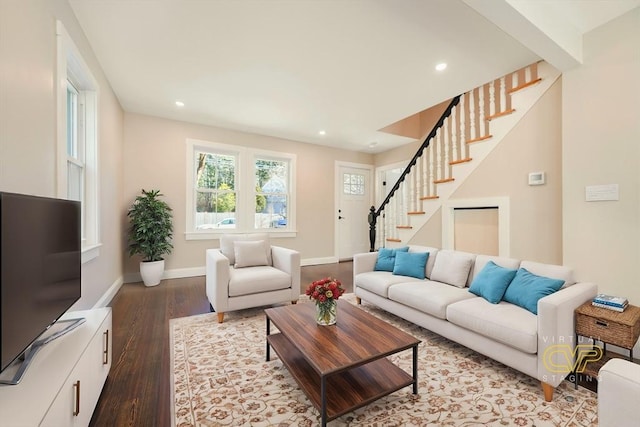 living room with recessed lighting, stairs, baseboards, and wood finished floors