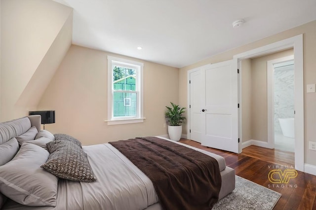 bedroom featuring baseboards and hardwood / wood-style floors