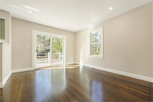 unfurnished room featuring visible vents, recessed lighting, baseboards, and hardwood / wood-style floors