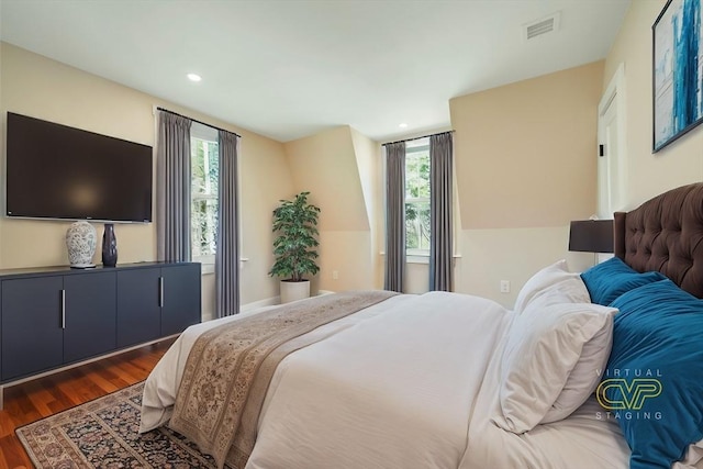 bedroom featuring recessed lighting, wood finished floors, and visible vents