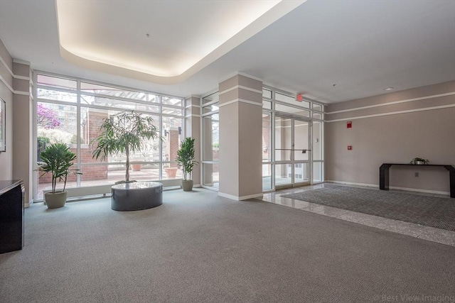 building lobby featuring a wall of windows