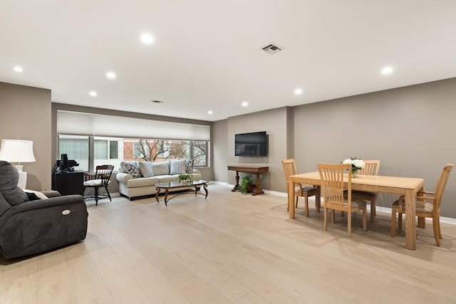 living room with light hardwood / wood-style floors