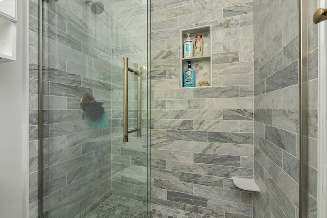 bathroom featuring an enclosed shower