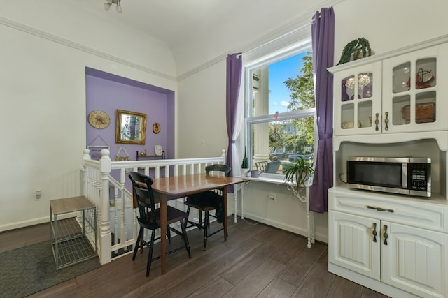 dining room with dark hardwood / wood-style flooring