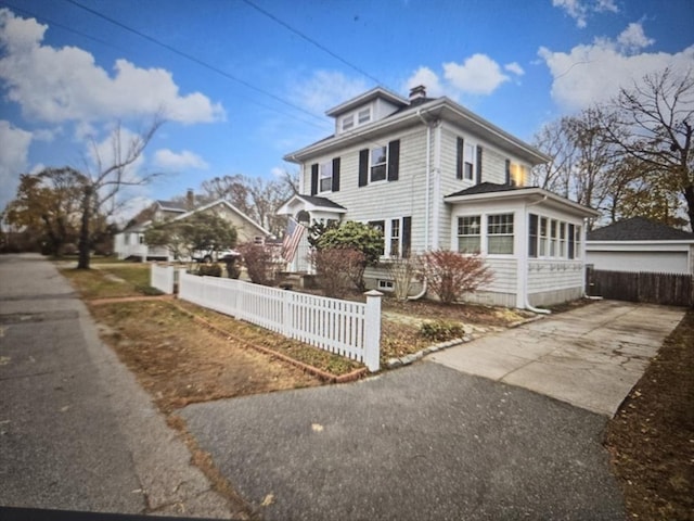 view of side of home with a fenced front yard