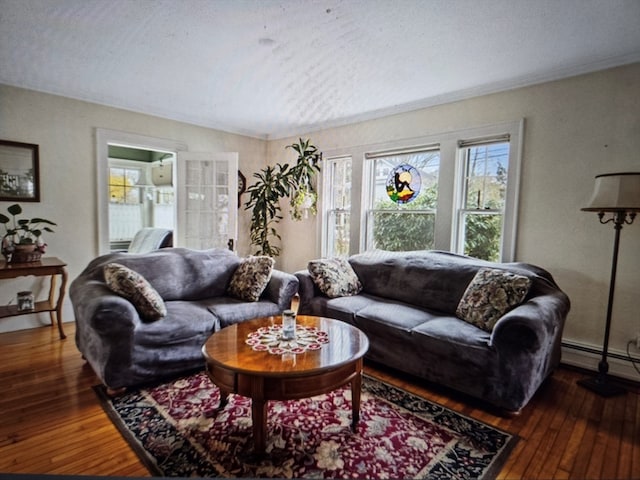 living room featuring a baseboard heating unit, a textured ceiling, ornamental molding, and dark hardwood / wood-style floors