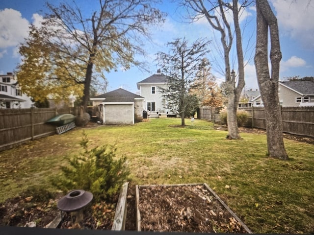 view of yard featuring a garage