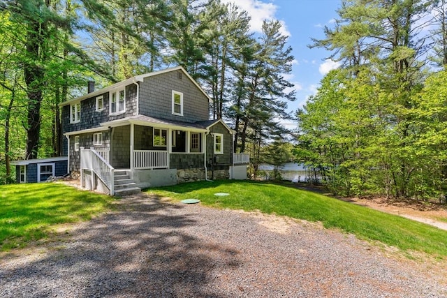 31 Brookside Dr, North Smithfield, RI 02896 - view of front of property with a porch, a front yard, a chimney, and a water view