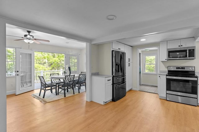 31 Brookside Dr, North Smithfield, RI 02896 - kitchen featuring appliances with stainless steel finishes, white cabinets, baseboards, light wood-style flooring, and recessed lighting