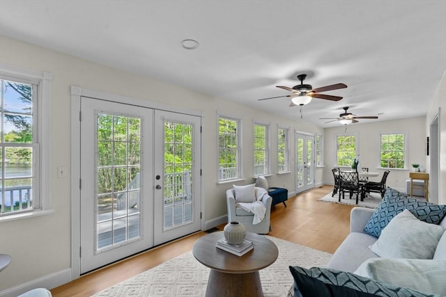 31 Brookside Dr, North Smithfield, RI 02896 - living area featuring french doors, a ceiling fan, wood finished floors, and baseboards